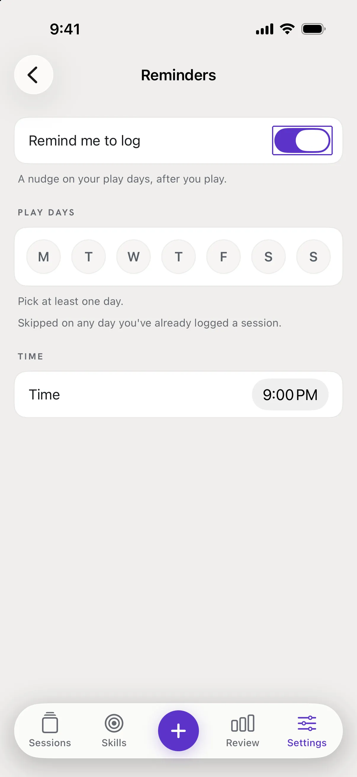 The Reminders screen with the Remind me to log switch outlined.